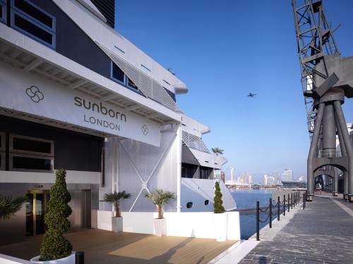 a large building with a large clock on top of it at Sunborn London Yacht Hotel in London