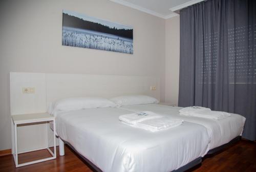 Uma cama ou camas num quarto em Casa Seoane