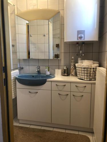 a bathroom with a sink and a mirror at Ferienhaus Silke in Knittelfeld