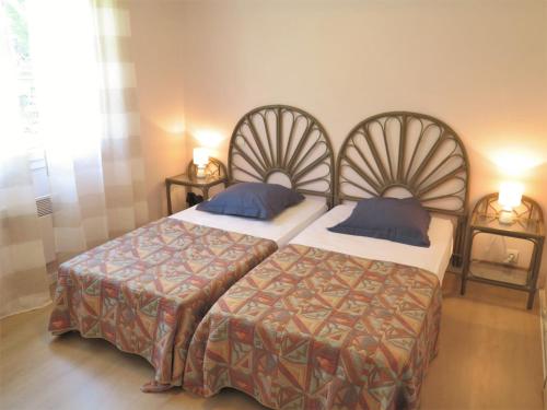 Katil atau katil-katil dalam bilik di Holiday Home Le Moïsan by Interhome