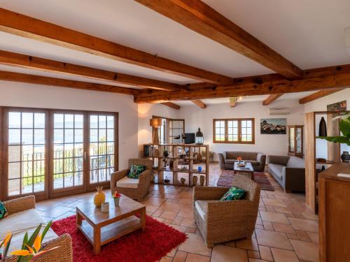 a living room with couches and tables at Holiday Home St- Joseph by Interhome in Propriano