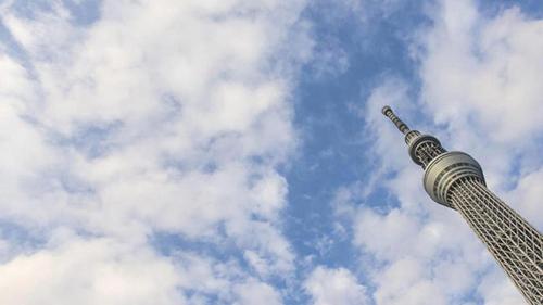 a tall building with a cloudy sky in the background at Toyoko Inn Tokyo Asakusa Kuramae No.2 in Tokyo