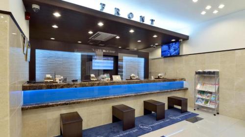 a waiting area in a store with a blue counter at Toyoko Inn Tokyo Asakusa Kuramae No.2 in Tokyo