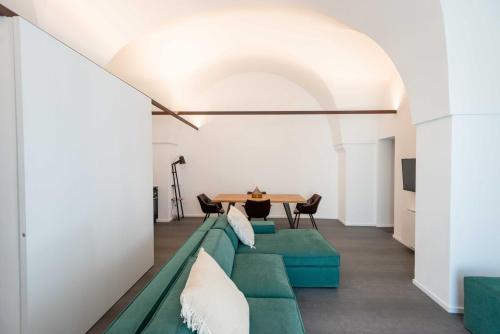 a living room with a couch and a table at Arya Nobile Dimora in Carovigno