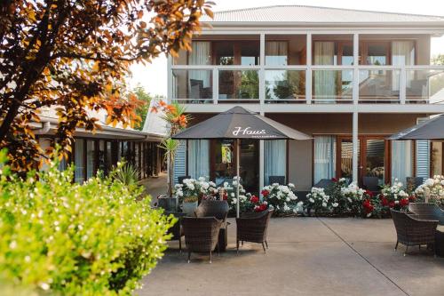 a restaurant with tables and chairs in front of a building at The Manna, Ascend Hotel Collection in Hahndorf
