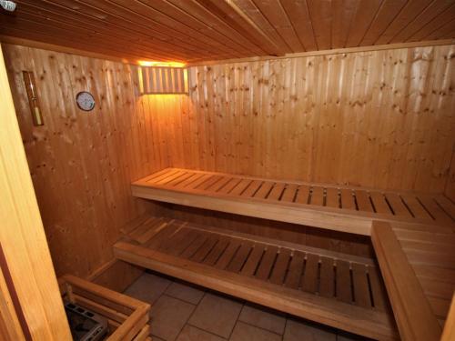 a wooden sauna with a bench in the middle at Holiday Home Krechen Alm by Interhome in Pernegg an der Mur