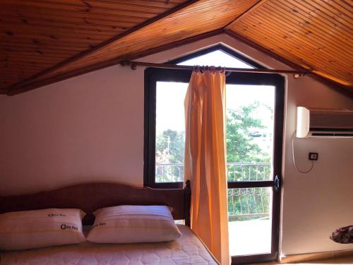 Postel nebo postele na pokoji v ubytování Hotel Gjinaj