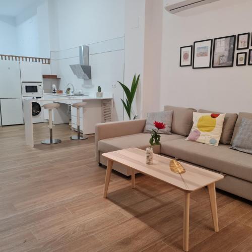 a living room with a couch and a coffee table at La Victoria 3 in Córdoba