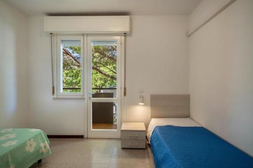 Postel nebo postele na pokoji v ubytování Villa Luca Trilocale 3