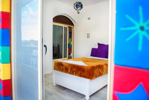 Postel nebo postele na pokoji v ubytování Onaty Ka Guest House