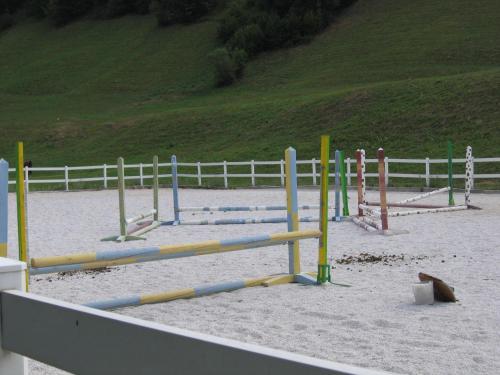 a beach with a bunch of play equipment in the sand at Apartment Sever in Idrija