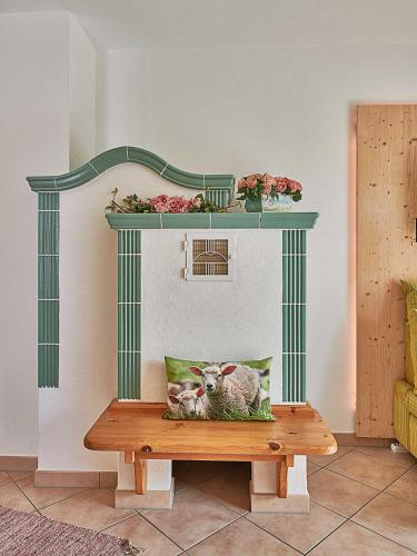 a table with a picture of a sheep on it at Zum Sonnenhuegel in Wegscheid