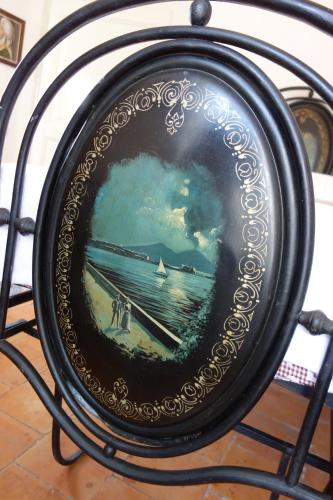 a framed picture of a painting of a pier at Antica Dimora Fuori Le Mura B&B in Scanno