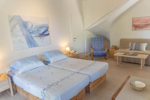 A bed or beds in a room at Secluded Beach Apartments