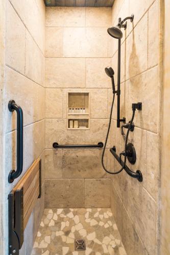 a bathroom with a shower with a shower head at Ancient Lore Village in Knoxville