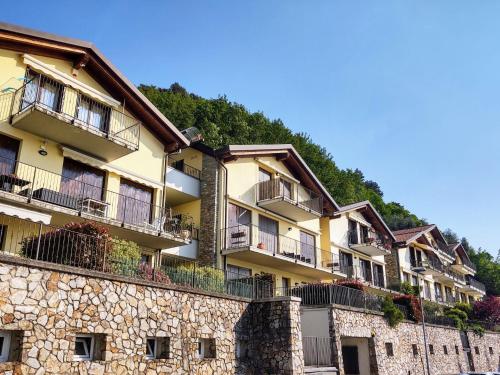 a row of buildings on top of a stone wall at Apartment Belvedere by Interhome in Bellano