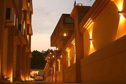 an alley with lights on the side of a building at ShriGo Hotel Haridwar in Haridwār