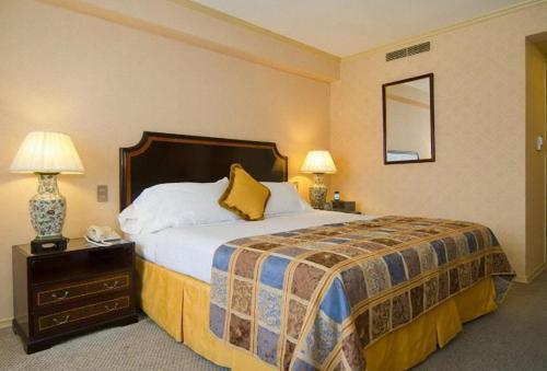 Кровать или кровати в номере Park Plaza Santiago