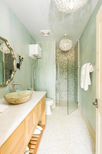 a bathroom with a sink and a glass shower at Ancient Lore Village in Knoxville