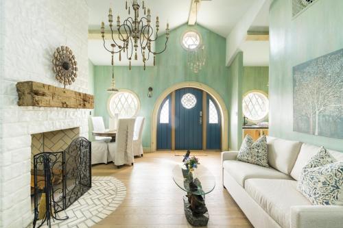 a living room with a couch and a fireplace at Ancient Lore Village in Knoxville