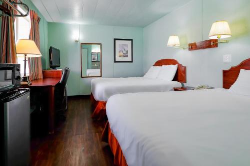 Llit o llits en una habitació de Route 66 Inn of Santa Rosa, NM
