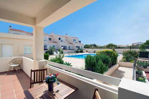 a balcony with a view of a swimming pool at 205 Casa Cactus in Sagres