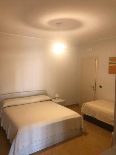 Postel nebo postele na pokoji v ubytování B&B Il Sogno
