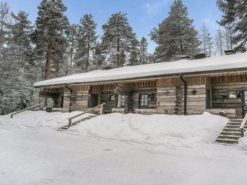 a log cabin in the snow with snow at Holiday Home Vuokatinportti b 8 by Interhome in Vuokatti