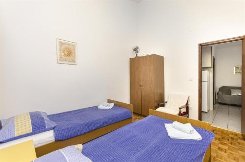 Posteľ alebo postele v izbe v ubytovaní Apartments and Room Lotus