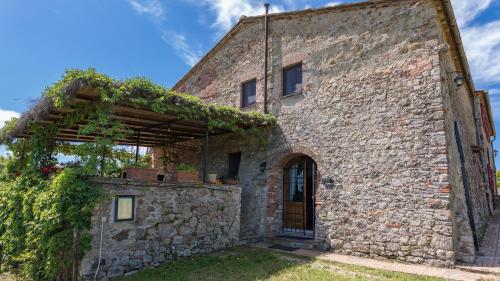 an external view of a stone building with a door at PODERE SAN ANSANO 14&2, Emma Villas in Paganico