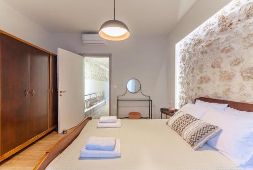 Ένα ή περισσότερα κρεβάτια σε δωμάτιο στο Evangelia Residenza, elegant stay in Herakleion!