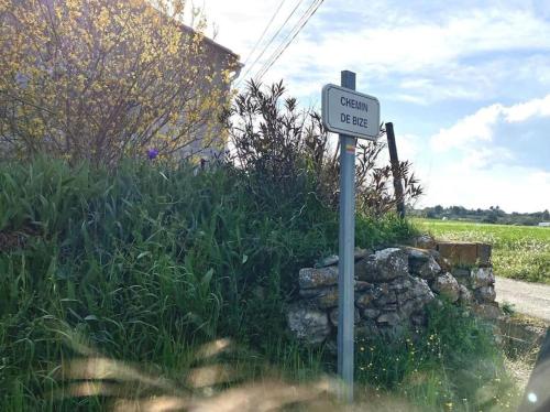 a sign on the side of a road at NOUS in Agel