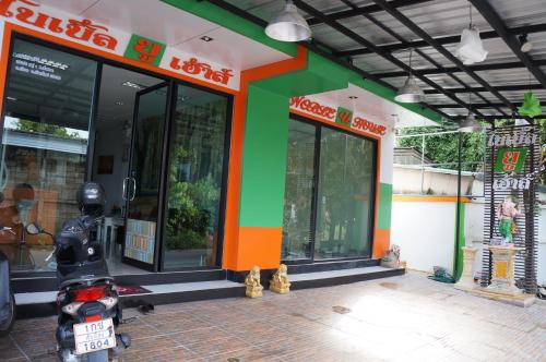 a scooter parked in front of a store at Noble U-house Chiangmai in Chiang Mai