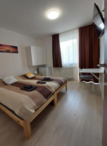 a bedroom with a large bed in a room at Arsenal House Budapest in Budapest