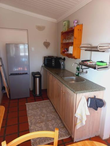 Kuchyň nebo kuchyňský kout v ubytování Abalone Guesthouse