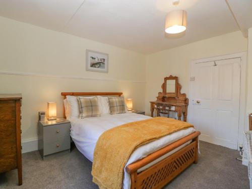 Cama ou camas em um quarto em Bell Cottage