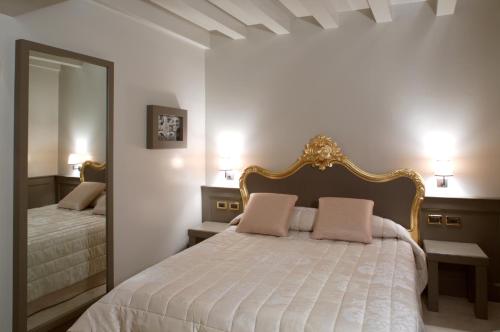 Posteľ alebo postele v izbe v ubytovaní Hotel Ca' Zusto Venezia