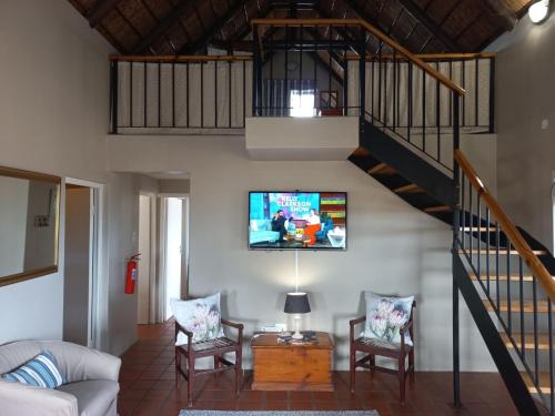 TV a/nebo společenská místnost v ubytování Abalone Guesthouse