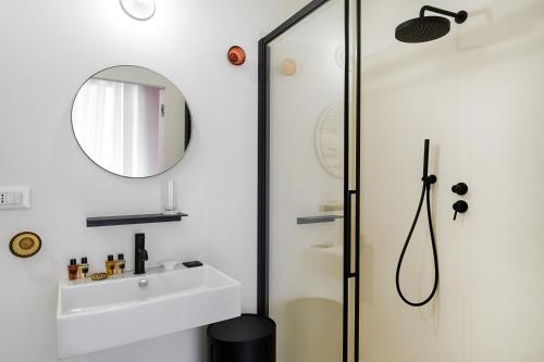a bathroom with a sink and a mirror at A.D. 1768 Boutique Hotel in Ragusa