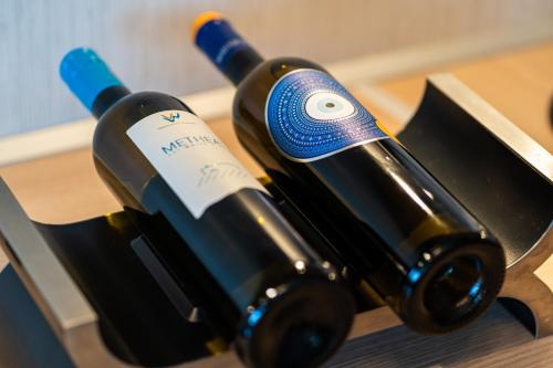 two bottles of wine sitting on a table at Bay View House in Petalidi