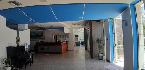 an office with a blue ceiling in a hallway at Sea Palace Hotel in Marina di Fuscaldo