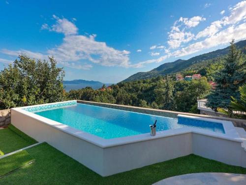 a swimming pool in the yard of a house at Villa Vita,free wifi,nearby sea in Opatija