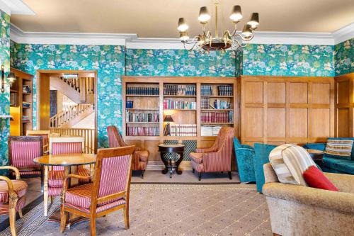 a living room with a couch and chairs and a table at The Grand Hotel in Torquay