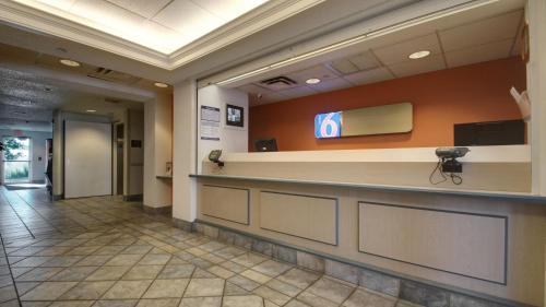 a lobby of a hospital with a sign on the wall at Motel 6 Lehi, UT - Thanksgiving Point in Lehi