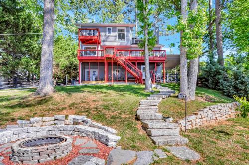 a house with a fire pit in the yard at Morning Mist Lake House in Lithonia