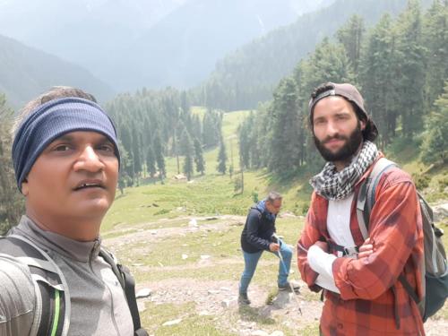 two men standing on top of a mountain at Kashmir Outlook Adventures in Pahalgām