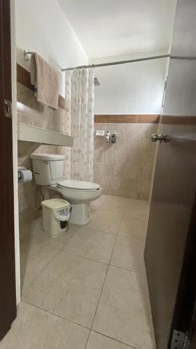 a bathroom with a toilet and a sink at Departamento Orellana 11 in Chetumal