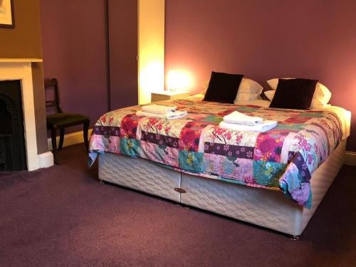 מיטה או מיטות בחדר ב-Circles Guest House