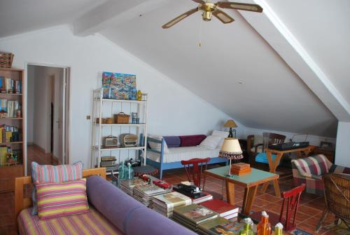 a living room with a couch and a table at Monte Ramos in Ferreira do Alentejo