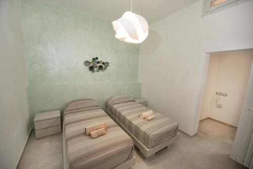 Ένα ή περισσότερα κρεβάτια σε δωμάτιο στο Lecce Santa Chiara Terrace piano rialzato